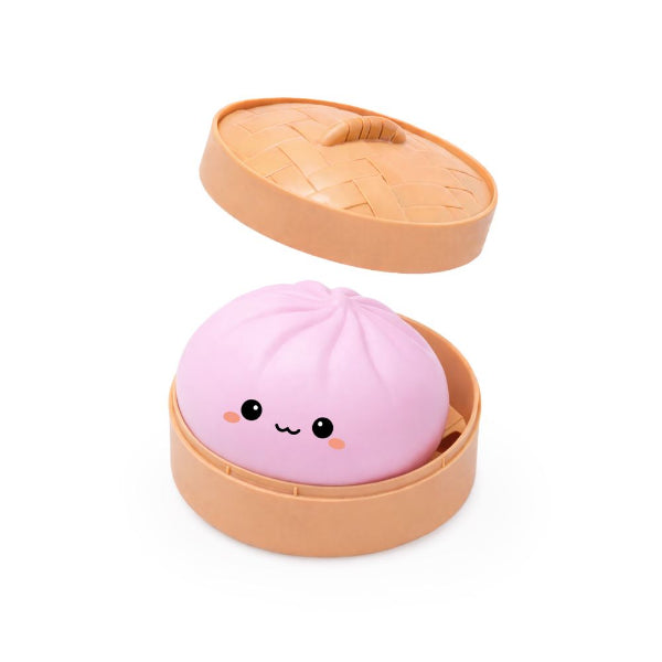Pink bun-shaped product with a face in an open beige container on a white background