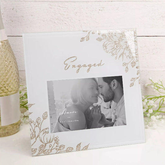 Decorative photo frame with floral design and 'Engaged' text on a white background